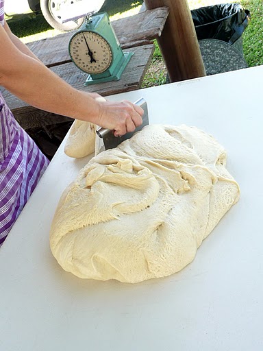 Then the baker weighs out the dough.